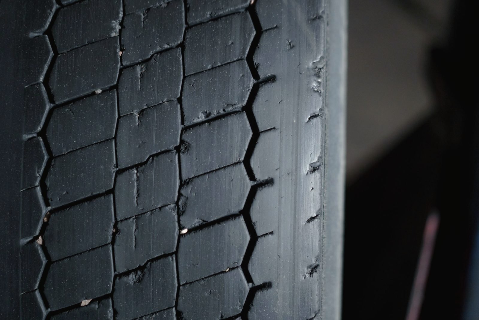 Close view of a worn truck tire tread